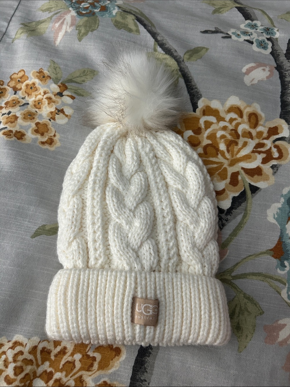 UGG  Ivory Cable Knit Beanie with Faux-Fur Pom